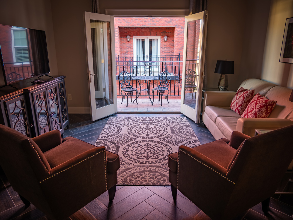 The wrought-iron private balcony of the Balcony King suite, looking out over the breezeway.