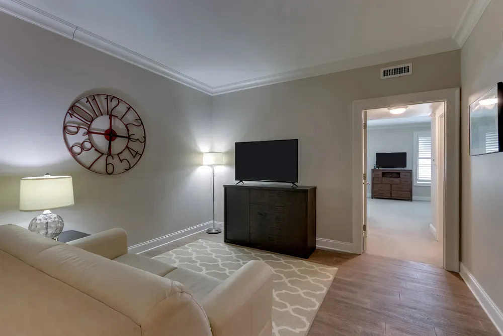 The sitting room of the Deluxe Dual Queen, looking through to the second room.